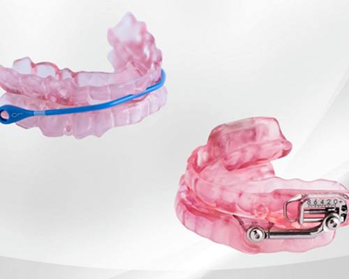 woman holding oral appliance