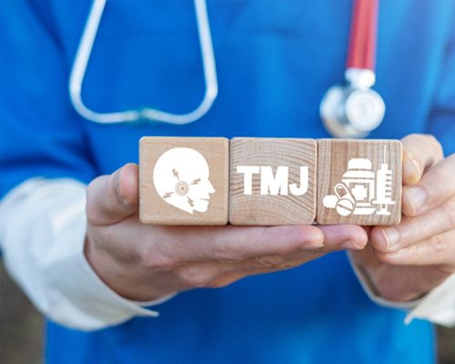 TMJ and TMD health care concept blocks in a doctor’s hands